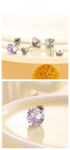 Macro detail of round-cut zircon studs with stainless steel screw back fasteners