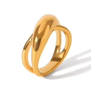 Detail of a golden croissant-style stainless steel ring with a polished 3D curved surface