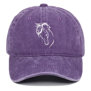 Detail of horse head embroidery on vintage purple washed cotton baseball cap texture
