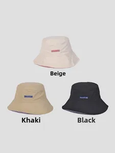 Detailed comparison of cotton bucket hats in beige, khaki, and black with plaid lining