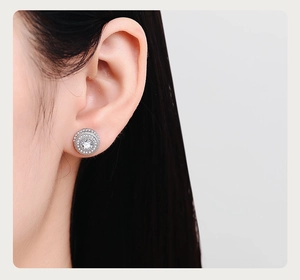 Macro shot of silver halo stud earring with multi-layered micro-pave zircon crystals
