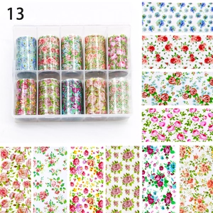 Detail of 10 rolls vintage floral nail art transfer foils in a transparent storage box