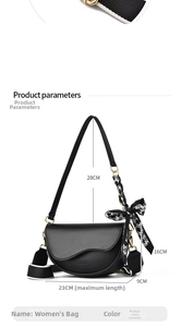 Detailed view of black leather saddle bag with classic lettering and dimensions 23x9x16cm