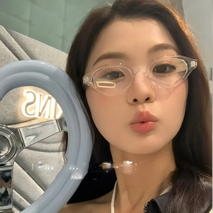 Minimalist transparent oval frame glasses for women, stylish clear blue light blocking eyewear