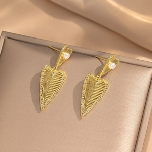 Elegant gold heart earrings with white pearls and sparkling rhinestones for women