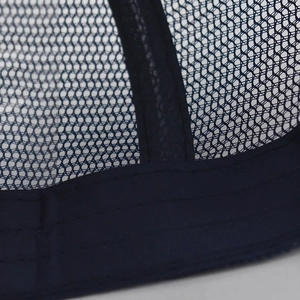 Close-up of dark blue baseball cap with breathable mesh and reinforced double stitching