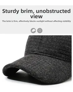Detail of the stiff dark gray wool baseball cap brim featuring Fashion lettering