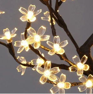 Elegant LED cherry blossom tree lamp with warm yellow light for home decoration