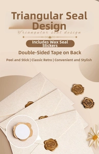 Detail of vintage linen envelope with gold wax seal sticker featuring 'Thank You' text