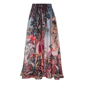 Detail of high-waisted A-line wrap skirt with tropical parrot and floral print pattern