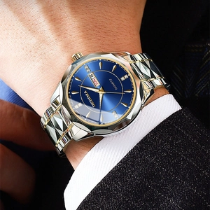 Men's business quartz watch with blue dial and gold markers worn on wrist
