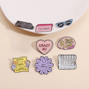 Set of 9 colorful enamel badges with motivational quotes for bags and clothes decoration