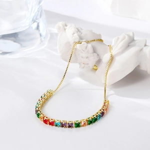 Detail view of colorful square-cut zircon stones on a gold-plated adjustable chain