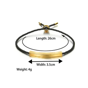 Minimalist black braided cord bracelet with adjustable gold plated curved metal bar