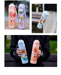Close-up of cute cartoon water bottles with nylon straps and colorful illustrations