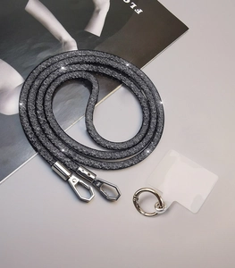 Detail of sparkly rhinestone phone lanyard with clear connector and metal clasp hooks