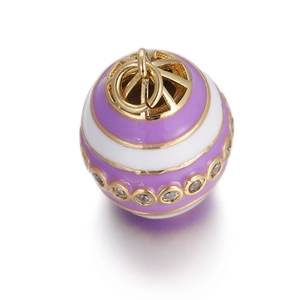 Detailed view of evil eye charm with purple and white stripes and gold plating