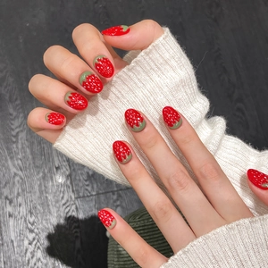 Handmade strawberry cat eye press-on nails with 3D texture and red gradient finish