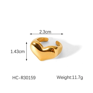 Detail shot showing chunky gold heart ring dimensions 2.3cm by 1.43cm and 11.7g weight