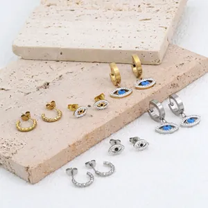 Hip hop style evil eye stud earrings set with sparkling zircon in gold and silver finish