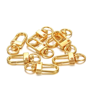 Detailed close-up of golden zinc alloy swivel lobster clasps for DIY crafts and keychains