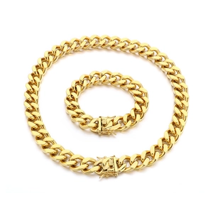 Polished gold 13mm Cuban link chain necklace and bracelet set with dragon clasp
