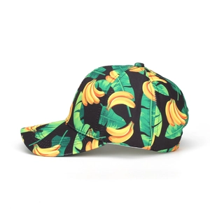 Tropical fruit print baseball cap with yellow bananas and palm leaves on black fabric