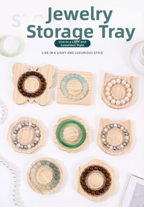 Macro view of assorted pine wood jewelry trays with intricate animal and floral shapes