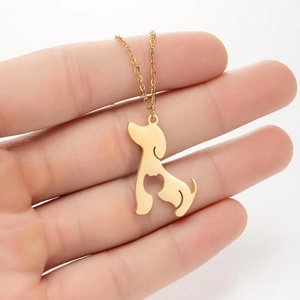 Golden necklace featuring a unique dog and cat silhouette pendant on a delicate chain