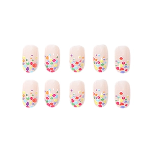 Candy colored press-on nails with colorful polka dots on natural nude base