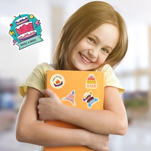 Girl holding orange book with cute cartoon birthday cake stickers and Happy Birthday text