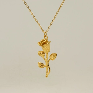 Detailed view of a 18K gold plated 3D rose flower pendant with textured leaf details