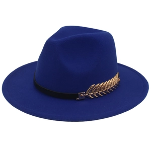 Close-up of dark blue wool felt fedora with elegant golden metal leaf detail on black band