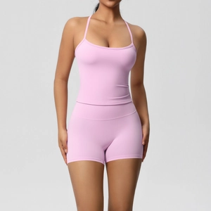Detailed view of criss-cross strap back and stitching on the purple yoga tank top