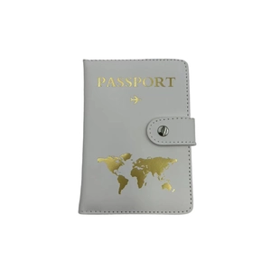 Detail of white PU leather passport holder with gold foil text and snap button closure