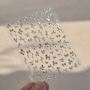 3D nail stickers with golden bows and pearls design, product model TO-481B by Tomoni