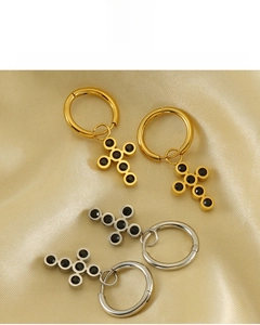 Detail of 18k gold plated cross hoop earrings with black stones and lead-free material
