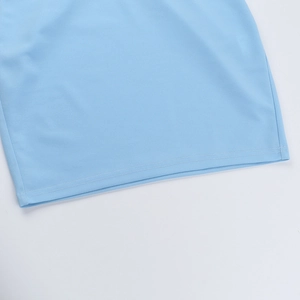 Detail view of the light blue dress hemline featuring high-quality double stitching