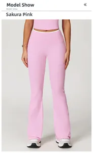 Detail of high-waisted flared yoga pants in cherry blossom pink with soft fabric texture