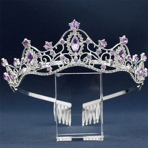 Detailed macro view of silver bridal crown with purple rhinestones and secure metal combs