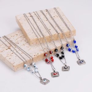 Set of four retro stainless steel evil eye necklaces in assorted enamel colors