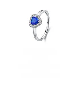 Macro view of S925 sterling silver stamp and heart-shaped blue opal ring detail