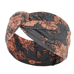 Detail of dark grey and orange floral yoga headband with twisted knot design