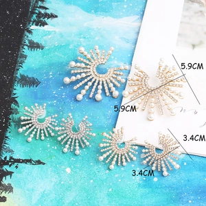Golden sunflower earrings set with pearls and rhinestones in two sizes for party wear