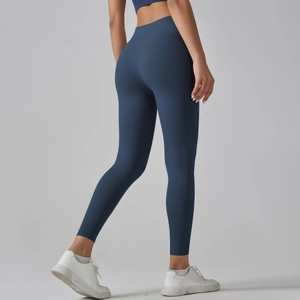 Rear view of high-waisted navy yoga pants showing compression and lifting effect