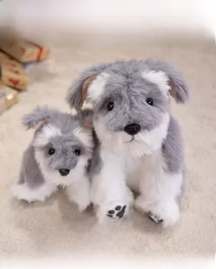 Macro shot of grey and white Schnauzer plush toy set with realistic long faux fur detail