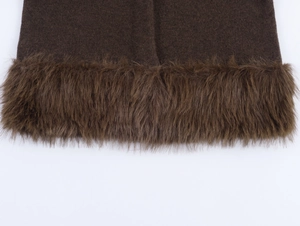 Detail of dark brown knit jacket featuring faux fur trim on cuffs and textured wool fabric