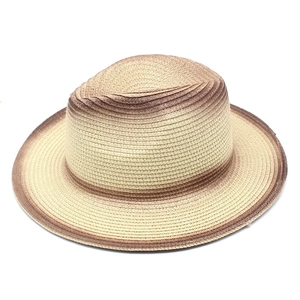 Detailed macro shot of fine woven texture and brown gradient finish on fedora hat