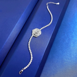 Elegant S925 sterling silver rose bracelet with sparkling cubic zirconia on blue box