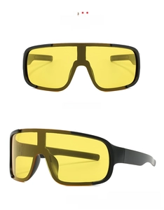 Front and side views of matte black cycling goggles with high-contrast yellow night vision lens